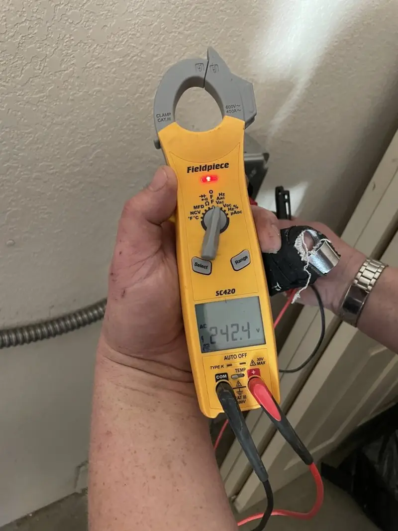Voltage testing with clamp meter during Electrical Installation Services in Loris